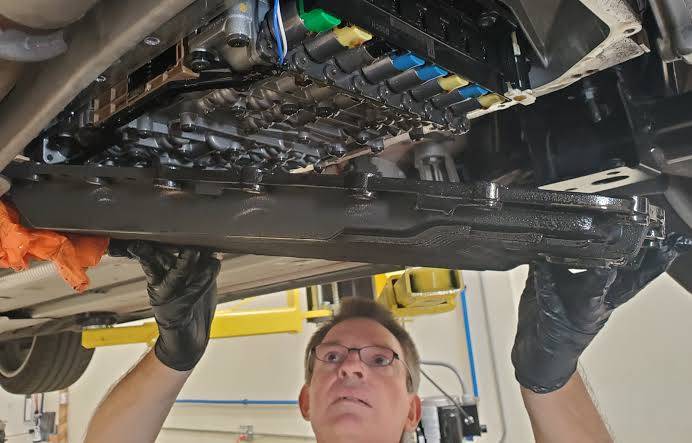 Changing your transmission filter and pan gasket sweeps away metal debris and stops fluid leaks.. Source: Aston 1936